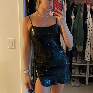 Black sequence spaghetti strap dress with small slit and flare bottom